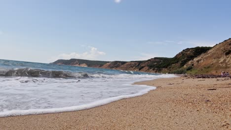 cinematic sea and ocean waves glide across the sand