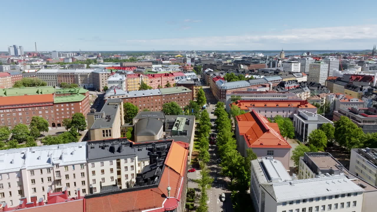 Aerial view of a bus driving on the streets of Toolo, summer day in Helsinki