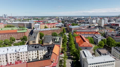 aerial view of a bus driving on the streets of toolo, summer day in helsinki