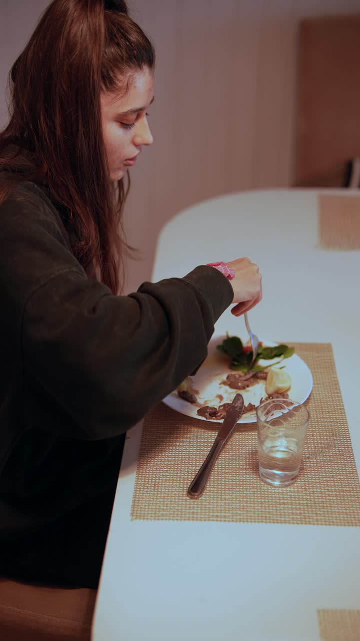 Woman eating dinner