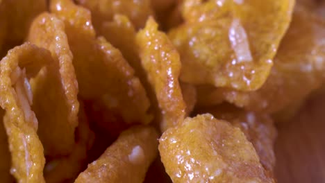 macro slider over sugar coated, unhealthy cornflakes