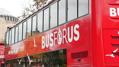 red double-decker bus with "busforus" branding