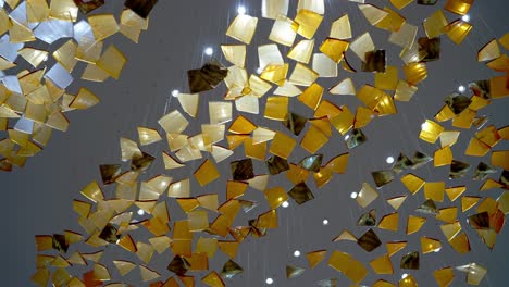 a ceiling decorated by colorful glass and warm led strip in a large hotel in el alamein, egypt low angle shot