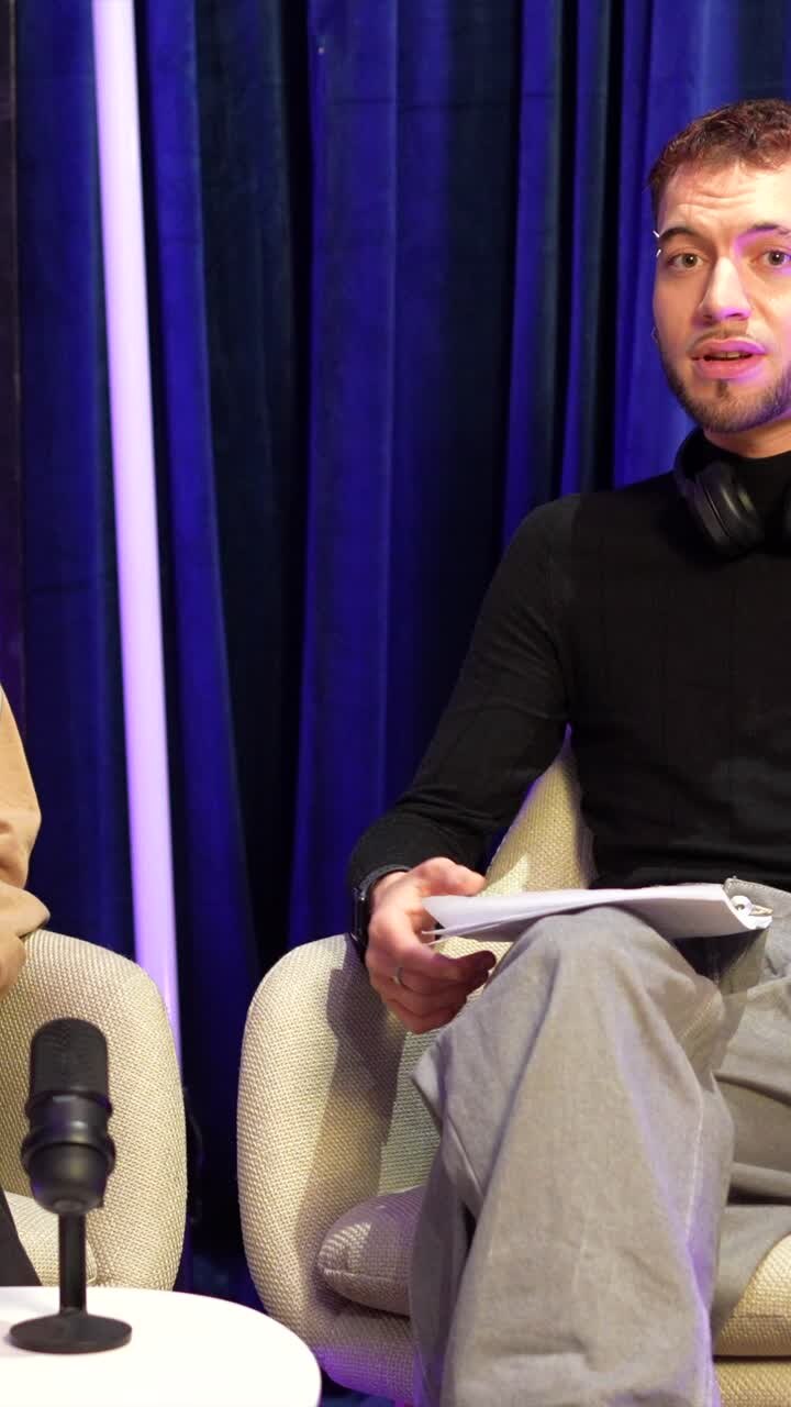 Happy Woman and Man in a Modern Studio Interview