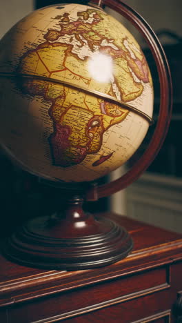 vintage world globe on wooden stand