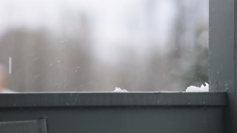 slow motion water dripping on a balcony during a rain storm
