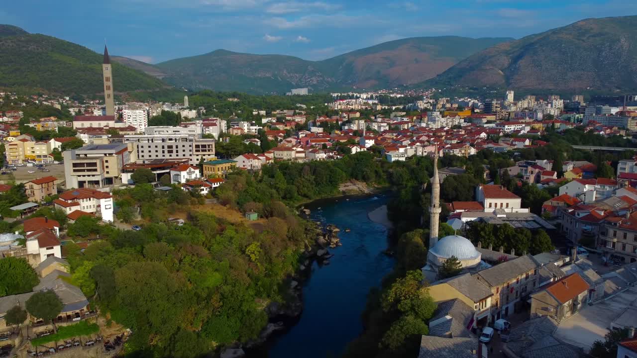 Scenic aerial view of Mostar and Neretva River on a sunny summer's morning - Mostar, Bosnia and Herzegovina
