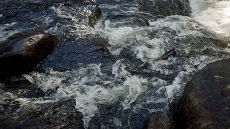Gushing-River-Cascading-Over-Rapids-And-Rocks-In-Saint-Côme,-Quebec,-Canada---slow-motion