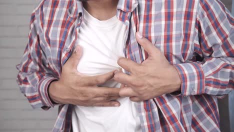 man experiencing chest pain