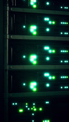 a close up of a server rack in a dark data center