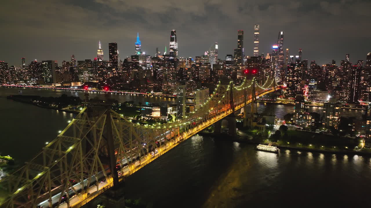 Ed Koch Queensboro Bridge Illuminated At Night In New York City - Aerial Drone Shot