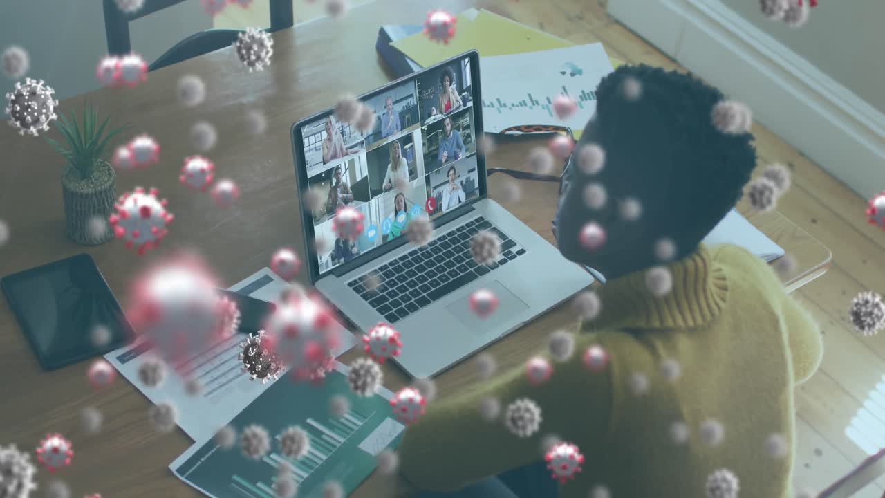 Animation of covid 19 cells over woman using laptop on video call