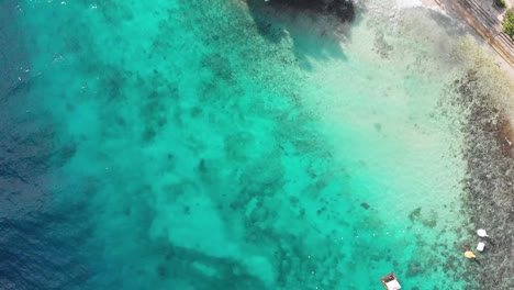 Cinematic-aerial-drone-shot-of-iconic-resort-in-philippines-island,-with-crystal-clear-blue-water,-white-sand-and-cliff-jumping-on-hot-sunny-summer-day-2