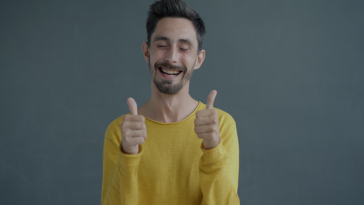 Man clapping and laughing