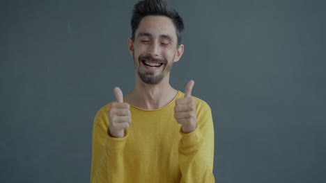 man clapping and laughing