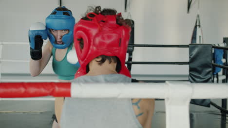 women boxing training session in ring