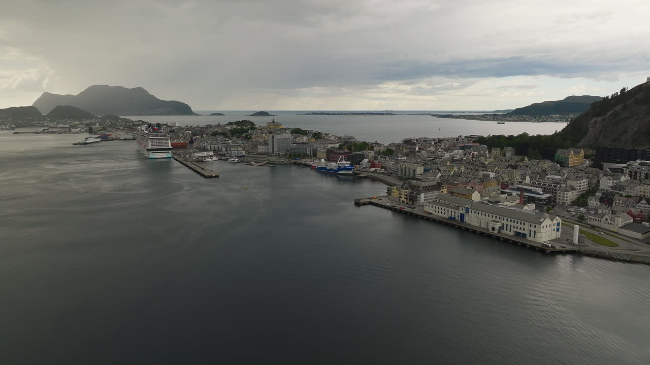 Cruise ship docked in &Aring;lesund port town, Norway