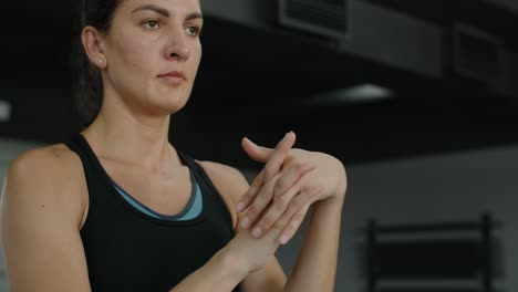 woman warming up before boxing training in gym