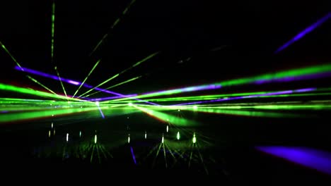 static shot of colorful laser performance at night