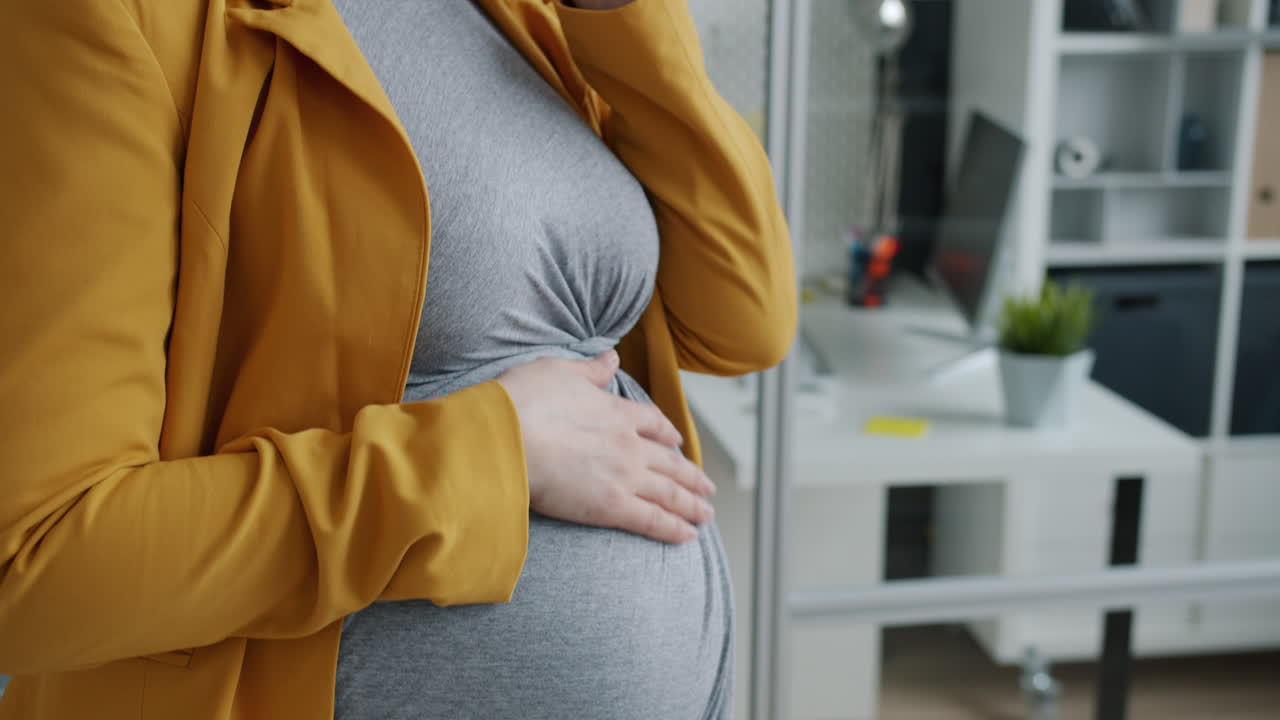Pregnant woman in office