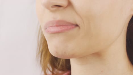 woman eating nuts in close-up, dried fruits