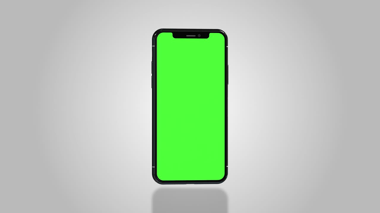 Smartphone turns on with green screen. Seamlessly loopable