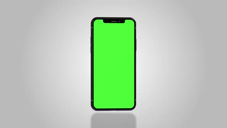 smartphone turns on with green screen. seamlessly loopable