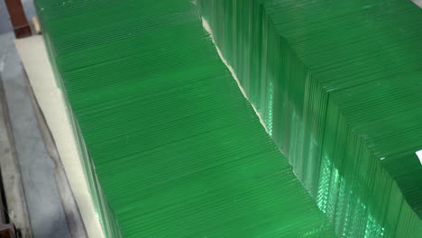 two rows of small green glass squares in the warehouse