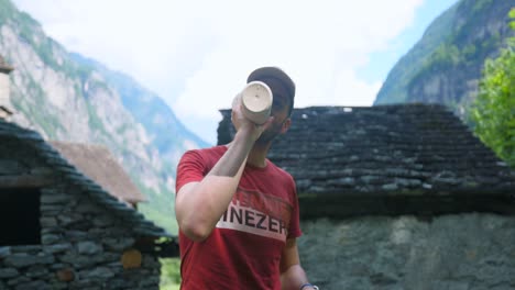 Man-Drinking-From-Thermal-Flask-Then-Walk-Away