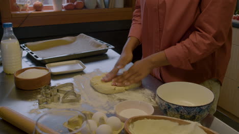 woman kneading dough