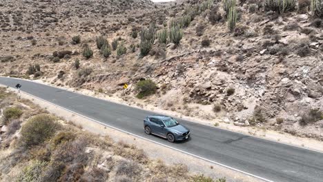 Low-aerial-front-view-of-a-car-driving