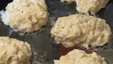 fried dough/cakes in a pan