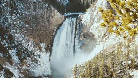 yellowstone falls with ice and snow wide shot