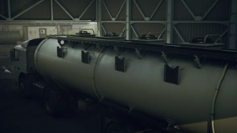 large white cistern trucks in a factory