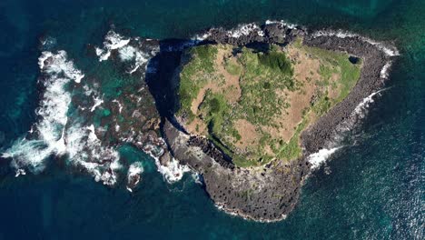 bird's eye view over cook island or turtle island in nsw, australia - drone shot