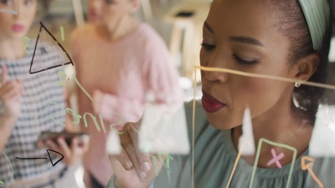 Happy diverse business people discussing work during meeting at office