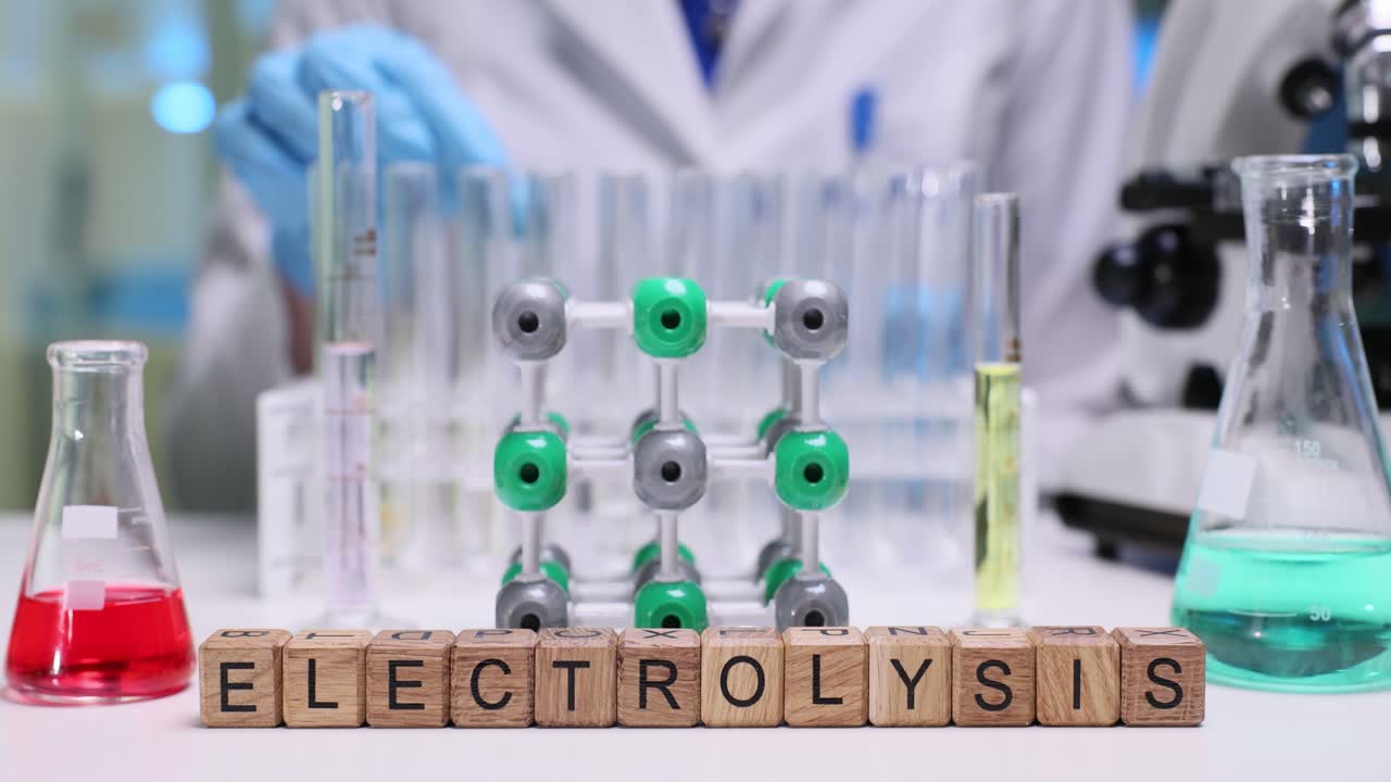 Wooden cubes form term electrolysis indicating conducted process