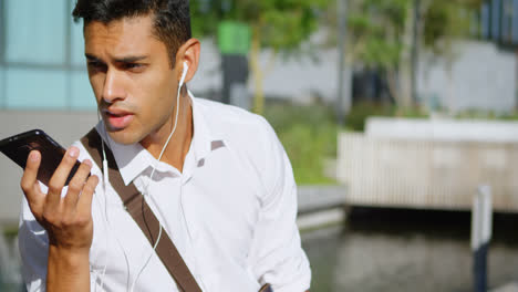 man talking on mobile phone outside 4k