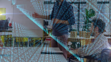Binary code animation over people collaborating in modern office setting