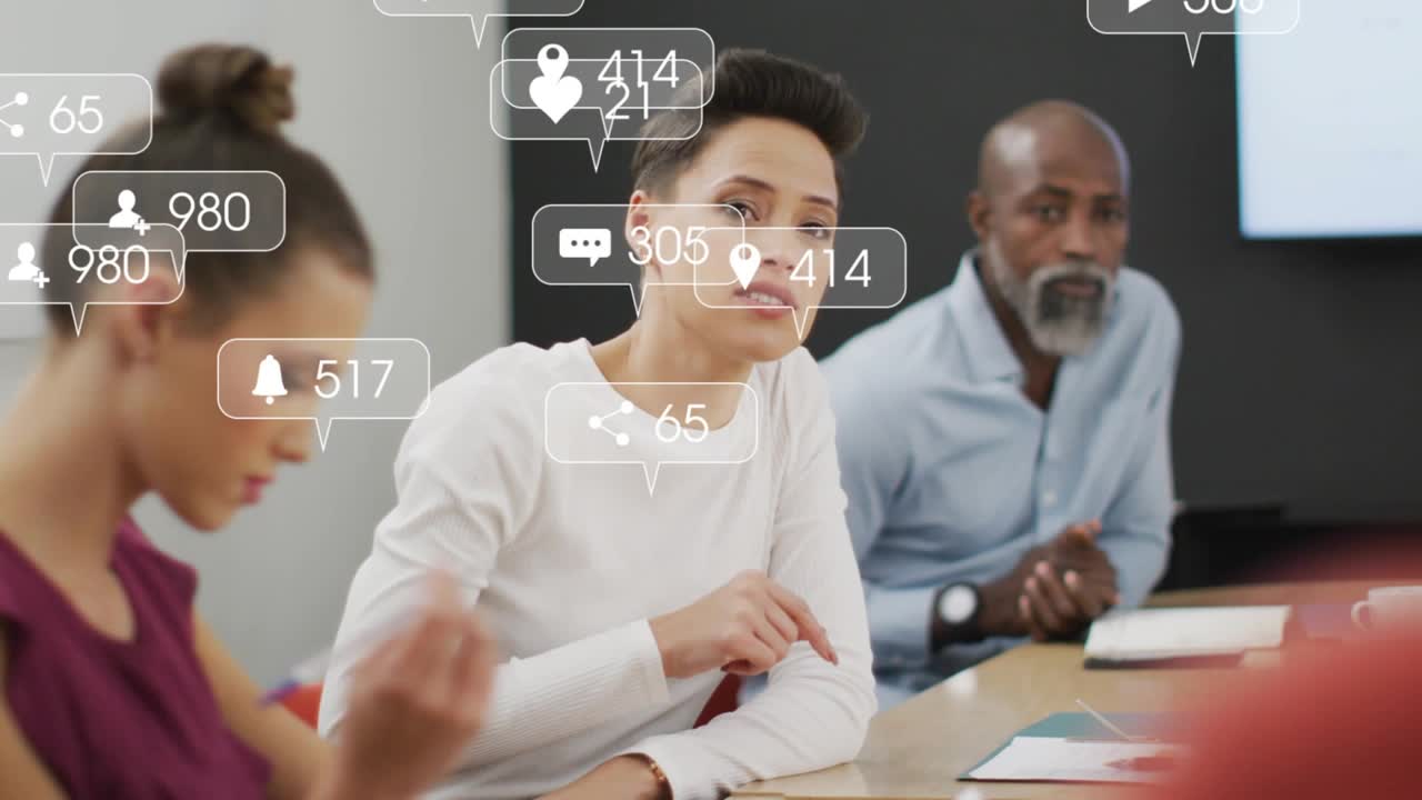 Team lead speaking and pointing in business meeting causing likes and comments multiplying