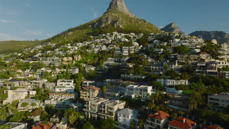 Forwards-fly-above-luxury-properties-in-tropical-tourist-destination-at-golden-hour.-Cape-Town,-South-Africa