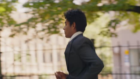 manager being late for the meeting, rushing through the park in slow motion