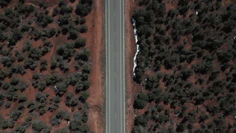 Aerial-view-of-black-car-driving-on-interstate-highway-in-Utah,-USA