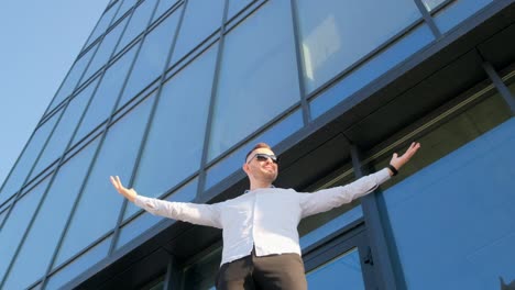 a man who is dressed in a police uniform is standing in front of a building