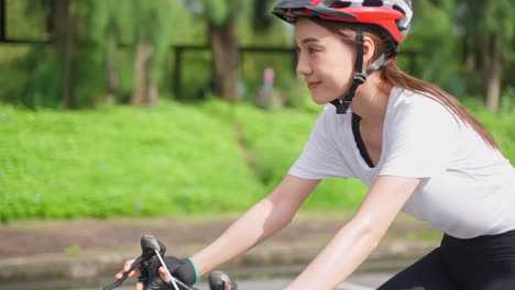 woman cycling in a park