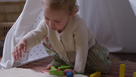 Close-up-view-of-baby-playing-at-home