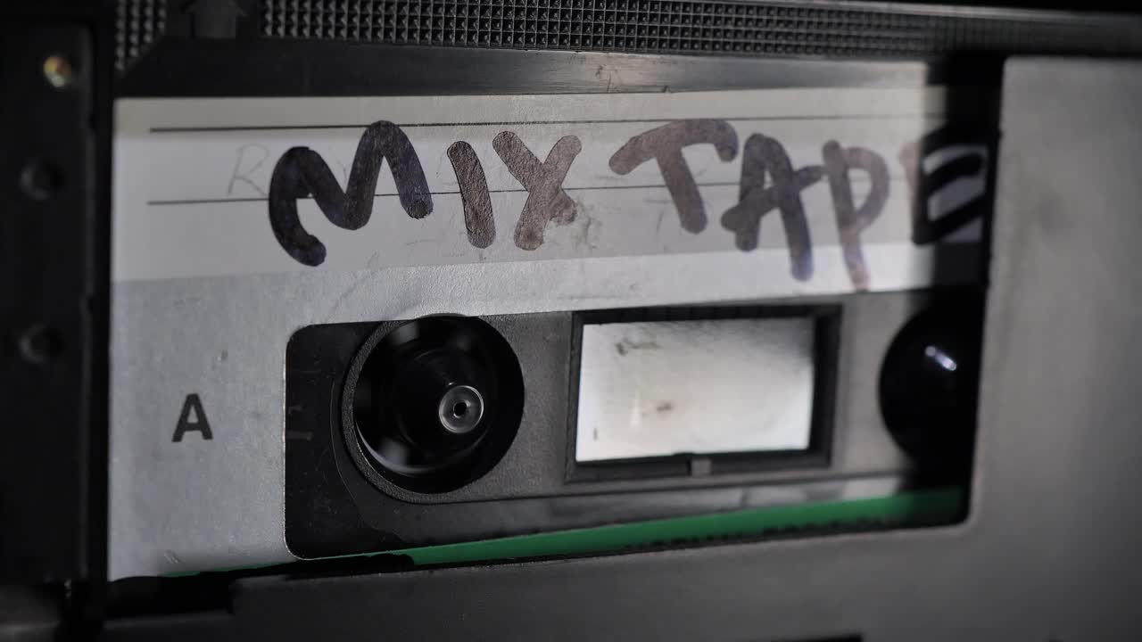 Cassette Tape. Vintage Tape Recorder Plays Audio Cassette tape inserted therein. Mix tape.