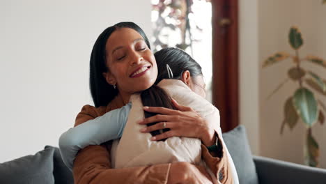 Family,-mother-and-daughter-hugging-on-a-sofa