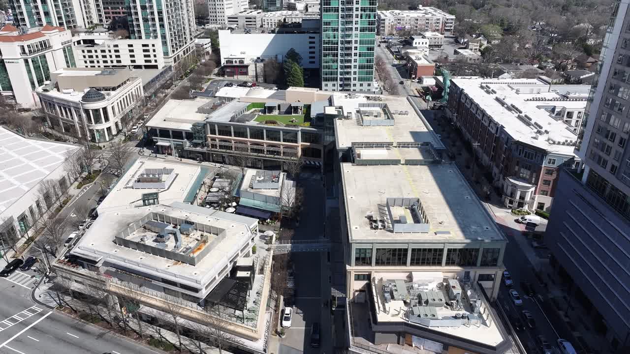 Atlanta upscale Buckhead neighborhood, restaurants, HVAC units on commercial and residential rooftop on a sunny day, Aerial