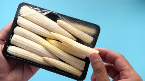 fresh baby corn in a tray